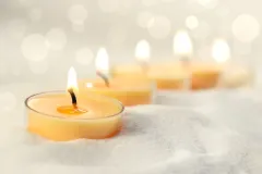 depositphotos_4969739-stock-photo-votive-candles-in-sand